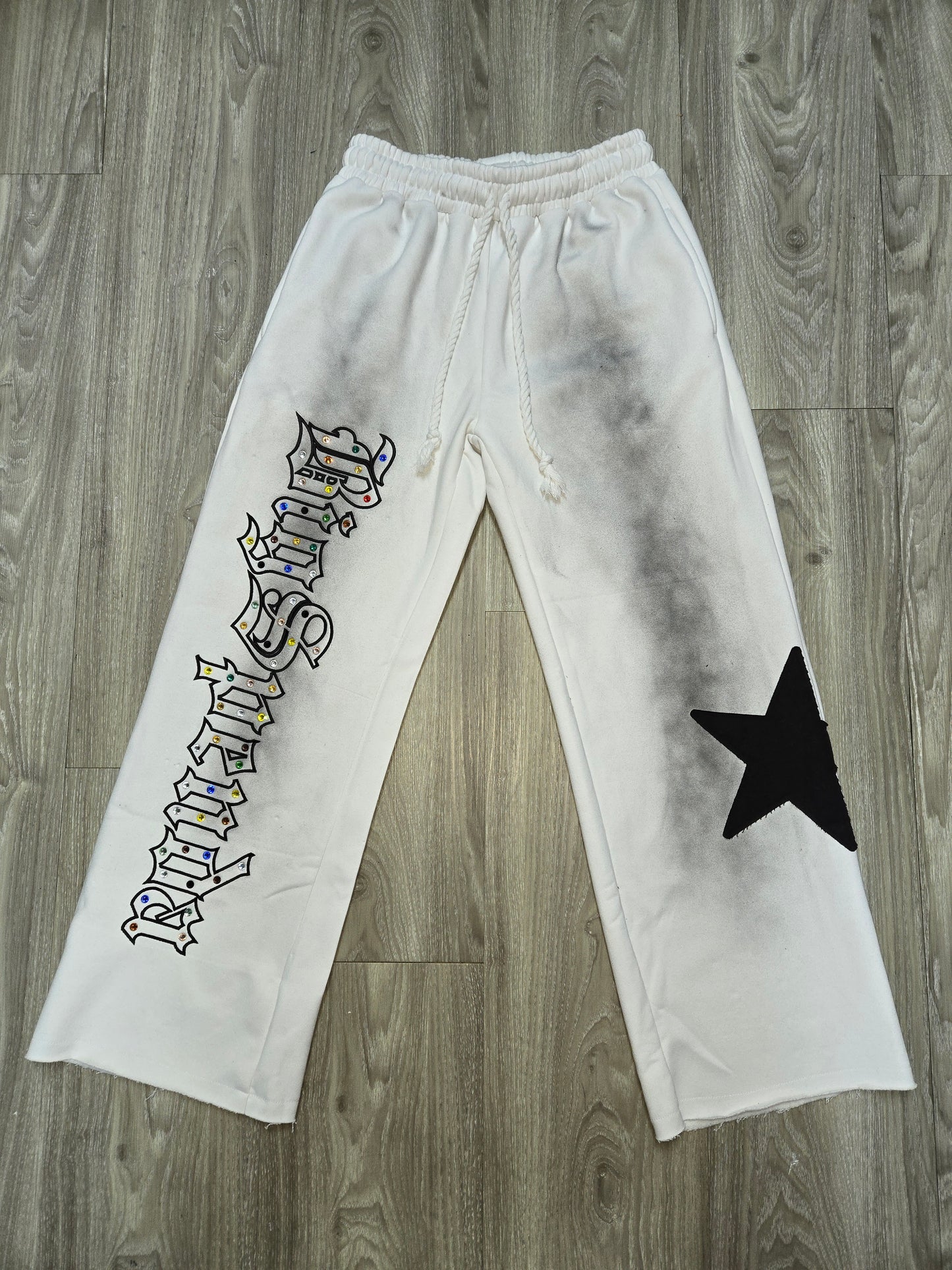 BS WHITE PANTS WITH BLK SUN FADE.. RHINESTONES